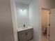 Small bathroom with tile flooring, vanity and toilet at 1012 India Ave, Haines City, FL 33844