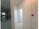 Hallway with marble tile floors leads to kitchen featuring a center island at 1012 India Ave, Haines City, FL 33844