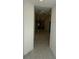 Open hallway leading to a kitchen featuring recessed lighting, marbled tile flooring, and fresh paint at 1012 India Ave, Haines City, FL 33844