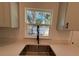 A kitchen window view over the kitchen sink showing the natural light at 1012 India Ave, Haines City, FL 33844