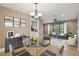 Bright dining area with a glass table and seating with easy access to living area at 104 E Cottesmore Cir, Longwood, FL 32779