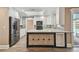 Bright kitchen with stainless steel appliances, white cabinetry, and a skylight at 104 E Cottesmore Cir, Longwood, FL 32779