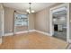 Open-concept living space featuring wood floors, a ceiling fan, and neutral paint at 104 E Cottesmore Cir, Longwood, FL 32779