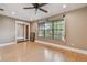 Bright living room with natural light, light-colored hardwood floors, and neutral walls at 104 E Cottesmore Cir, Longwood, FL 32779