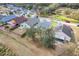 Aerial view of a residential neighborhood featuring well-maintained homes and green spaces at 1047 Bluegrass Dr, Groveland, FL 34736