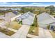 Exterior view of a well-maintained home with solar panels and a view of the wetlands at 1047 Bluegrass Dr, Groveland, FL 34736