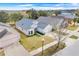 Exterior aerial view of a well-maintained home with landscaped yard at 1047 Bluegrass Dr, Groveland, FL 34736