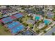 Aerial view featuring community tennis and basketball courts, pool, and clubhouse at 10509 Belfry Cir, Orlando, FL 32832