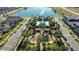 Aerial view of community pool, playground, and lake in a beautiful neighborhood at 10509 Belfry Cir, Orlando, FL 32832