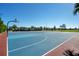 Outdoor basketball court with colorful surface in a well-maintained community park setting at 10509 Belfry Cir, Orlando, FL 32832