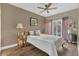 Bedroom showcasing hard wood floors, chandelier and sliding doors out to balcony at 10509 Belfry Cir, Orlando, FL 32832