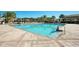 Large community pool with ample seating perfect for relaxing and socializing at 10509 Belfry Cir, Orlando, FL 32832