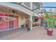 Covered patio with brick pavers and a ceiling fan, extends the living space outdoors at 10509 Belfry Cir, Orlando, FL 32832