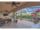 Spacious screened patio features brick pavers, ceiling fans and a view of the yard at 10509 Belfry Cir, Orlando, FL 32832