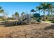 Community playground with slides, climbing wall, and mulch ground covering, perfect for recreation at 10509 Belfry Cir, Orlando, FL 32832