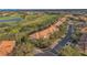 Street view of townhomes with mature landscaping; close to the community golf course at 10509 Belfry Cir, Orlando, FL 32832