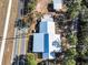 A top-down aerial view showcases the house, outbuildings, and the surrounding lush green landscape at 111 Water Tank Rd, Haines City, FL 33844