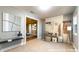 Staged entryway showcasing a modern console table and stylish coat rack with seating at 111 Water Tank Rd, Haines City, FL 33844