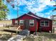 Quaint home with a welcoming front porch and ample natural light streaming through the windows at 111 Water Tank Rd, Haines City, FL 33844