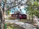 Inviting single Gathering home with a cozy front porch and a well-maintained driveway leading up to the entrance at 111 Water Tank Rd, Haines City, FL 33844