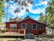 Exterior view of a single Gathering home featuring a cozy front porch and ample natural light streaming through the windows at 111 Water Tank Rd, Haines City, FL 33844