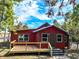 Charming home featuring a cozy front porch, ideal for enjoying peaceful mornings and welcoming guests at 111 Water Tank Rd, Haines City, FL 33844