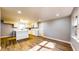 Bright kitchen with white cabinetry, modern appliances, and hardwood flooring at 111 Water Tank Rd, Haines City, FL 33844