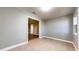 Bright living room with neutral paint, modern tile floors, and an open doorway to another room at 111 Water Tank Rd, Haines City, FL 33844