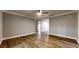 Spacious living room featuring hardwood floors, a ceiling fan, and an open layout for flexible design at 111 Water Tank Rd, Haines City, FL 33844