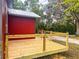 Exterior view featuring a newly constructed wood deck, perfect for outdoor relaxation and entertaining guests at 111 Water Tank Rd, Haines City, FL 33844