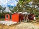 This exterior view displays home extension and backyard layout, offering versatility and outdoor potential at 111 Water Tank Rd, Haines City, FL 33844