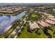 Aerial view of a home in a community featuring lakes, mature trees, and lush landscaping at 11716 Astilbe Dr, Orlando, FL 32827