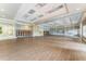 Large ballroom with hardwood floors, neutral walls, and ample space for events and gatherings at 11716 Astilbe Dr, Orlando, FL 32827