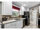 Functional kitchen featuring white cabinets, stainless steel appliances, and ample counter space at 11716 Astilbe Dr, Orlando, FL 32827