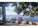 Picturesque lakeside beach scene featuring boat docks and people enjoying the sun and water at 11801 Lake Susan Ct, Clermont, FL 34711