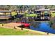 Scenic waterfront with a private dock, providing direct access to the canal and covered boat lift at 11801 Lake Susan Ct, Clermont, FL 34711