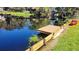 Waterfront dock with boat access for enjoying leisure activities on the calm canal at 11801 Lake Susan Ct, Clermont, FL 34711