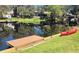 Waterfront property with a private dock and boat lift perfect for boating and enjoying nature views at 11801 Lake Susan Ct, Clermont, FL 34711