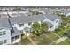 Aerial view showcasing the townhome, its well-maintained landscaping, and the surrounding neighborhood at 11867 Pulitzer Pl, Orlando, FL 32832