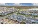 Panoramic aerial shot featuring the townhome community near a scenic lake and recreation areas at 11867 Pulitzer Pl, Orlando, FL 32832