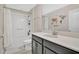 Bright bathroom featuring a shower and tub combo with a white vanity and a large mirror with world map wall art at 11867 Pulitzer Pl, Orlando, FL 32832