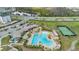 Aerial shot highlighting the resort-style pool, clubhouse, tennis court and amenities for community enjoyment at 11867 Pulitzer Pl, Orlando, FL 32832