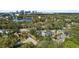 Beautiful aerial view of home featuring lush landscaping, a pool, and skyline at 1508 Delaney Ave, Orlando, FL 32806