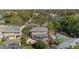 An aerial view of property highlighting surrounding mature trees and the patio at 1508 Delaney Ave, Orlando, FL 32806