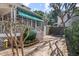 Cozy back patio with a covered porch, brick paving, and lush landscaping at 1508 Delaney Ave, Orlando, FL 32806