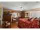 Warm bedroom featuring hardwood floors, a bed, and vintage decor at 1508 Delaney Ave, Orlando, FL 32806