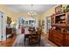 Beautiful dining room with hardwood floors, chandelier, and access to the kitchen at 1508 Delaney Ave, Orlando, FL 32806