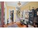 Inviting foyer with hardwood floors, staircase, and natural light, enhancing the home's entrance at 1508 Delaney Ave, Orlando, FL 32806