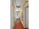 Second floor hallway with hardwood floors and vintage decor at 1508 Delaney Ave, Orlando, FL 32806