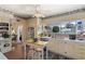 Classic kitchen featuring tile floors, white appliances, and a breakfast nook table at 1508 Delaney Ave, Orlando, FL 32806